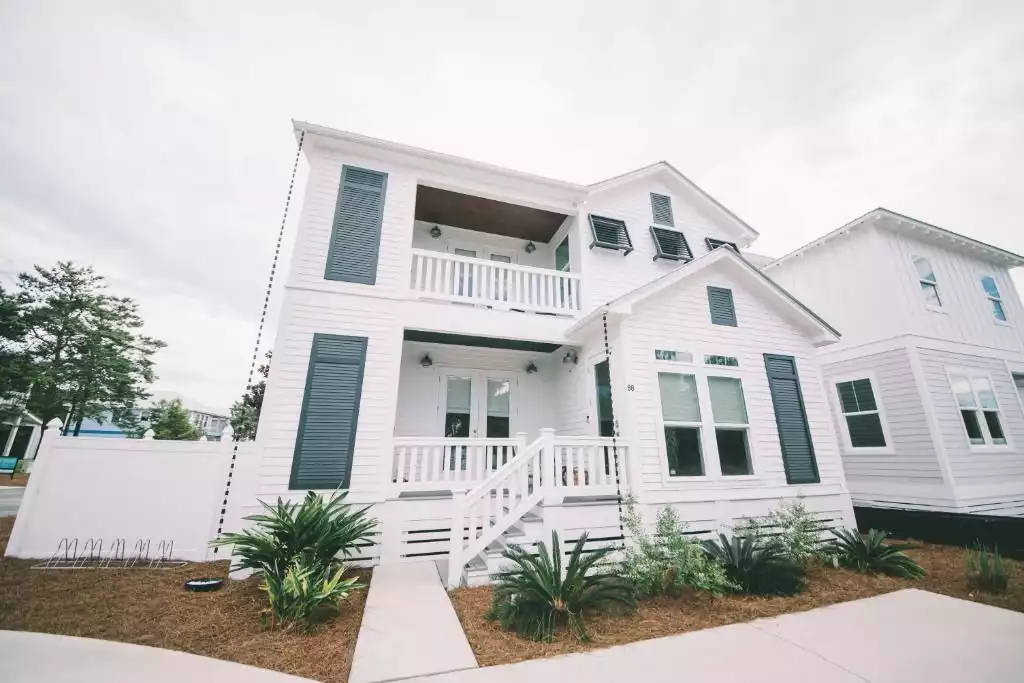 Dutch Treat cottage exterior with community pool behind